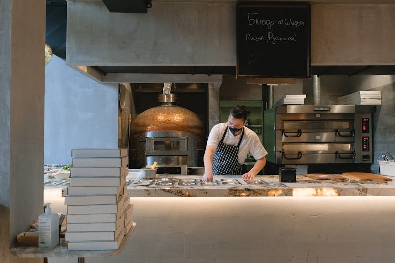 Jet's pizza team working together in the kitchen